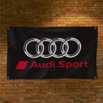 "Highlight your love for Audi Sport with this 3x5 ft flag. Ideal for car racing fans, garages, and man caves, this durable banner features bold Audi Sport graphics. Perfect for both indoor and outdoor use, it’s the ultimate wall décor sign to show your passion for high-performance cars and motorsport."