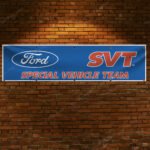 "Showcase your passion for performance with this Ford SVT banner, perfect for enthusiasts of Ford’s Special Vehicle Team. Measuring 2x8 ft, this high-quality banner features bold Ford SVT branding, making it an ideal addition to garages, man caves, workshops, or car show displays. Designed with durable materials for both indoor and outdoor use, it ensures vibrant colors and long-lasting appeal. Celebrate Ford’s legacy of high-performance engineering and innovation with this dynamic banner that highlights the SVT’s reputation for power and speed. Whether you're a collector, racing fan, or Ford truck enthusiast, this banner is a must-have décor piece that embodies Ford’s dedication to automotive excellence."