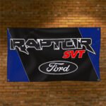 "Showcase your passion for the iconic Ford Raptor with this 3x5 ft banner flag, perfect for car and truck enthusiasts. Featuring the bold Ford Raptor logo and emblem, this high-quality banner is ideal for enhancing your garage, man cave, workshop, car shows, or as a standout advertising display. Made from durable materials, it offers vibrant colors and long-lasting appeal, suitable for both indoor and outdoor use. Celebrate the rugged power and performance of the Ford Raptor and Ford’s legacy in American racing and trucks with this stylish and versatile décor piece, perfect for any fan."