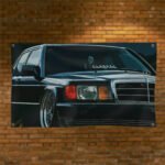 "Celebrate automotive history with this Mercedes-Benz 190E Photo Flag, measuring 3x5 ft. Featuring a stunning image of the iconic Mercedes-Benz 190E, this flag is a must-have for vintage car enthusiasts and collectors. Perfect for decorating your man cave, garage, or workshop, it brings a classic touch of Mercedes-Benz excellence to any space. Made from high-quality, weather-resistant materials, this banner ensures vibrant colors and durability for both indoor and outdoor use. Whether you're a fan of classic cars or motorsports, this Mercedes-Benz 190E photo flag makes a bold statement in your space, showcasing the legacy of one of the world’s finest automobile brands."