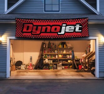 "Enhance your space with this 2x8 ft Dynojet flag banner, perfect for motorcycle enthusiasts and performance parts fans. Featuring bold Dynojet branding and sleek graphics, this banner is an ideal addition to garages, workshops, man caves, or motorcycle show displays. Crafted from durable, high-quality materials, it ensures vibrant colors and long-lasting appeal, suitable for both indoor and outdoor use. Show off your passion for motorcycle tuning and high-performance parts with this eye-catching banner that celebrates Dynojet’s reputation for precision and power. Whether you’re a racer, mechanic, or enthusiast, this Dynojet flag is the ultimate wall décor sign for those who demand performance and style."