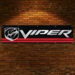 "Celebrate the legacy of the iconic Dodge Viper with this high-quality banner, perfect for car enthusiasts and collectors. Featuring bold Dodge Viper branding and sleek graphics, this banner is ideal for garages, man caves, workshops, or car shows. Crafted from durable materials, it ensures vibrant colors and long-lasting appeal for both indoor and outdoor use. Whether you're showcasing your passion for the Viper’s legendary power and performance or enhancing your automotive décor, this banner is a must-have for fans of American muscle and cutting-edge design."