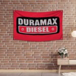 "Show your pride in Duramax Diesel power with this 3x5 ft banner, perfect for truck enthusiasts and fans of heavy-duty engines. Featuring bold Duramax Diesel branding and graphics, this durable banner is ideal for garages, man caves, workshops, or truck shows. Made from high-quality materials, it’s designed for both indoor and outdoor use, ensuring vibrant colors and long-lasting appeal. Celebrate the strength, performance, and legacy of Duramax Diesel engines with this must-have décor piece, perfect for showcasing your love for powerful, reliable diesel technology."