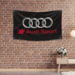 "Highlight your love for Audi Sport with this 3x5 ft flag. Ideal for car racing fans, garages, and man caves, this durable banner features bold Audi Sport graphics. Perfect for both indoor and outdoor use, it’s the ultimate wall décor sign to show your passion for high-performance cars and motorsport."