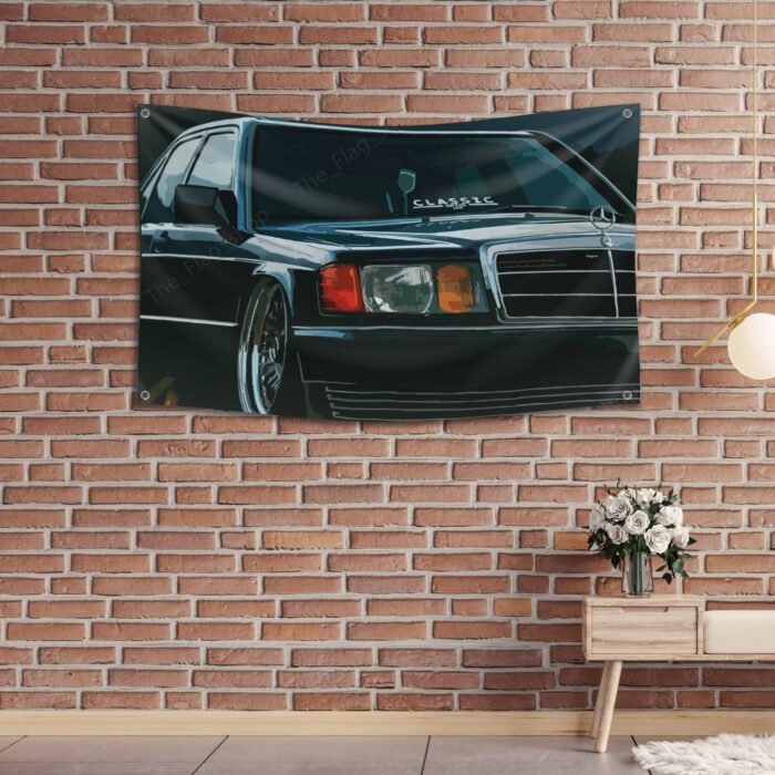 "Celebrate automotive history with this Mercedes-Benz 190E Photo Flag, measuring 3x5 ft. Featuring a stunning image of the iconic Mercedes-Benz 190E, this flag is a must-have for vintage car enthusiasts and collectors. Perfect for decorating your man cave, garage, or workshop, it brings a classic touch of Mercedes-Benz excellence to any space. Made from high-quality, weather-resistant materials, this banner ensures vibrant colors and durability for both indoor and outdoor use. Whether you're a fan of classic cars or motorsports, this Mercedes-Benz 190E photo flag makes a bold statement in your space, showcasing the legacy of one of the world’s finest automobile brands."