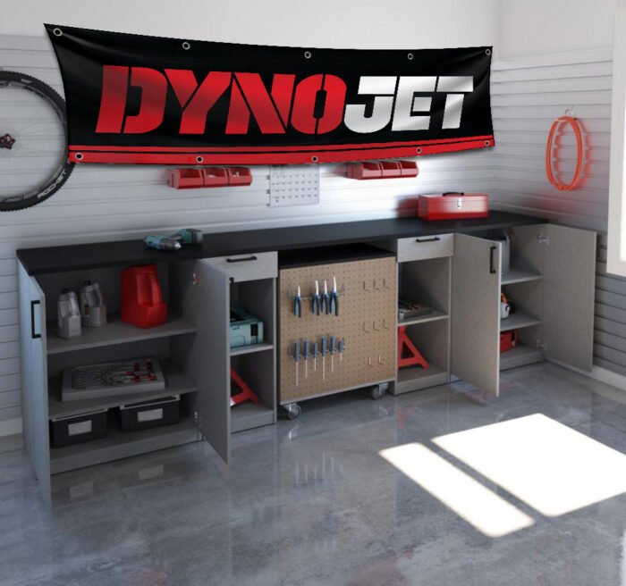 "Enhance your space with this 2x8 ft Dynojet flag banner, perfect for motorcycle enthusiasts and performance parts fans. Featuring bold Dynojet branding and sleek graphics, this banner is an ideal addition to garages, workshops, man caves, or motorcycle show displays. Crafted from durable, high-quality materials, it ensures vibrant colors and long-lasting appeal, suitable for both indoor and outdoor use. Show off your passion for motorcycle tuning and high-performance parts with this eye-catching banner that celebrates Dynojet’s reputation for precision and power. Whether you’re a racer, mechanic, or enthusiast, this Dynojet flag is the ultimate wall décor sign for those who demand performance and style."