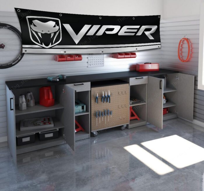 "Celebrate the legacy of the iconic Dodge Viper with this high-quality banner, perfect for car enthusiasts and collectors. Featuring bold Dodge Viper branding and sleek graphics, this banner is ideal for garages, man caves, workshops, or car shows. Crafted from durable materials, it ensures vibrant colors and long-lasting appeal for both indoor and outdoor use. Whether you're showcasing your passion for the Viper’s legendary power and performance or enhancing your automotive décor, this banner is a must-have for fans of American muscle and cutting-edge design."