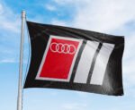 "Showcase your passion for Audi Motorsport with this 3x5 ft banner flag. Ideal for garages, man caves, or as wall décor, this durable flag features eye-catching Audi MotorSport graphics. Perfect for car racing fans, it’s designed for both indoor and outdoor use, making it a great addition to any space where motorsport enthusiasts gather."