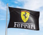 "Showcase your passion for luxury and speed with this 3x5 ft Ferrari flag, perfect for car enthusiasts and fans of Italian engineering. Featuring the iconic Ferrari logo and Italy-inspired design, this banner is an ideal addition to garages, man caves, workshops, or car show displays. Crafted from durable, high-quality materials, it ensures vibrant colors and long-lasting performance, making it suitable for both indoor and outdoor use. Celebrate the legacy of Ferrari’s excellence in car racing and sports cars with this bold and stylish décor piece. Whether you’re a collector or a racing enthusiast, this Ferrari flag is a must-have wall sign that embodies Italian craftsmanship and automotive performance."