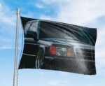 "Celebrate automotive history with this Mercedes-Benz 190E Photo Flag, measuring 3x5 ft. Featuring a stunning image of the iconic Mercedes-Benz 190E, this flag is a must-have for vintage car enthusiasts and collectors. Perfect for decorating your man cave, garage, or workshop, it brings a classic touch of Mercedes-Benz excellence to any space. Made from high-quality, weather-resistant materials, this banner ensures vibrant colors and durability for both indoor and outdoor use. Whether you're a fan of classic cars or motorsports, this Mercedes-Benz 190E photo flag makes a bold statement in your space, showcasing the legacy of one of the world’s finest automobile brands."